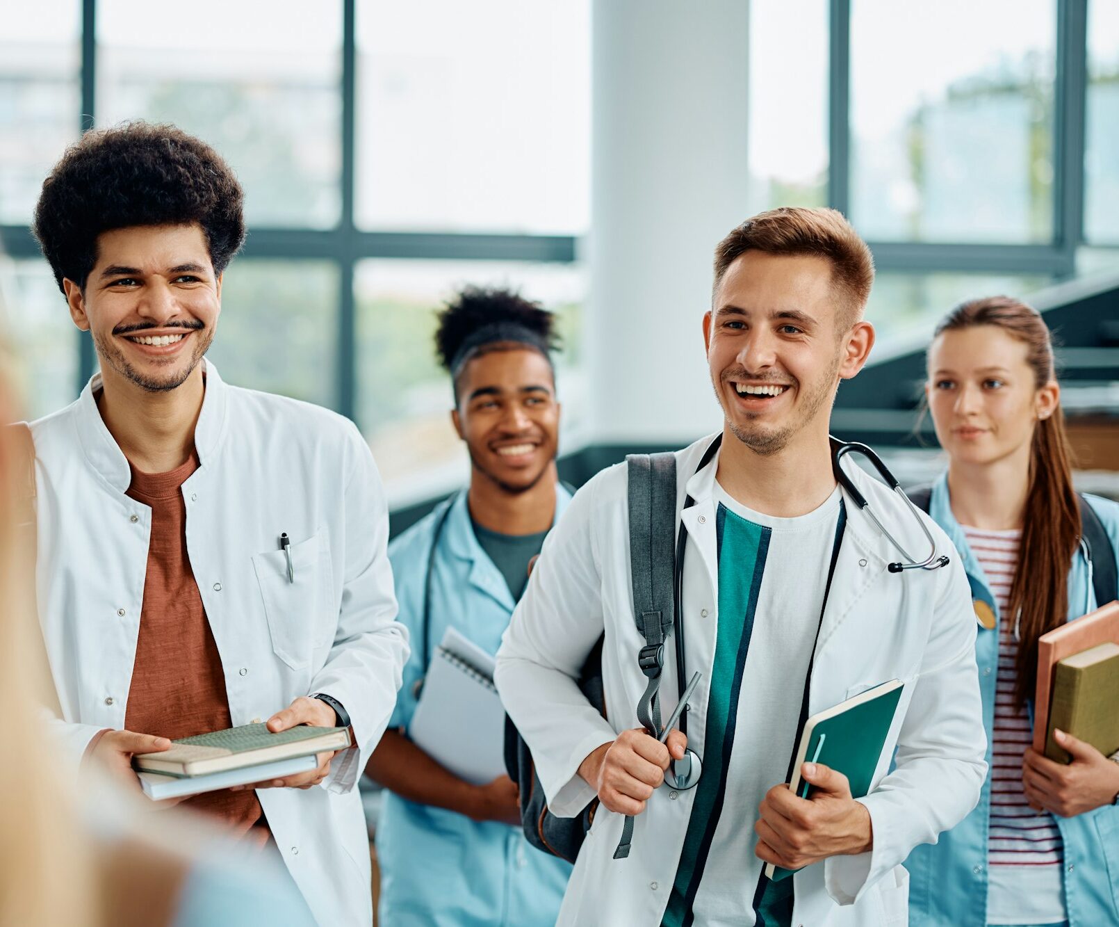 Happy students of medicine in lecture hall at the university.
